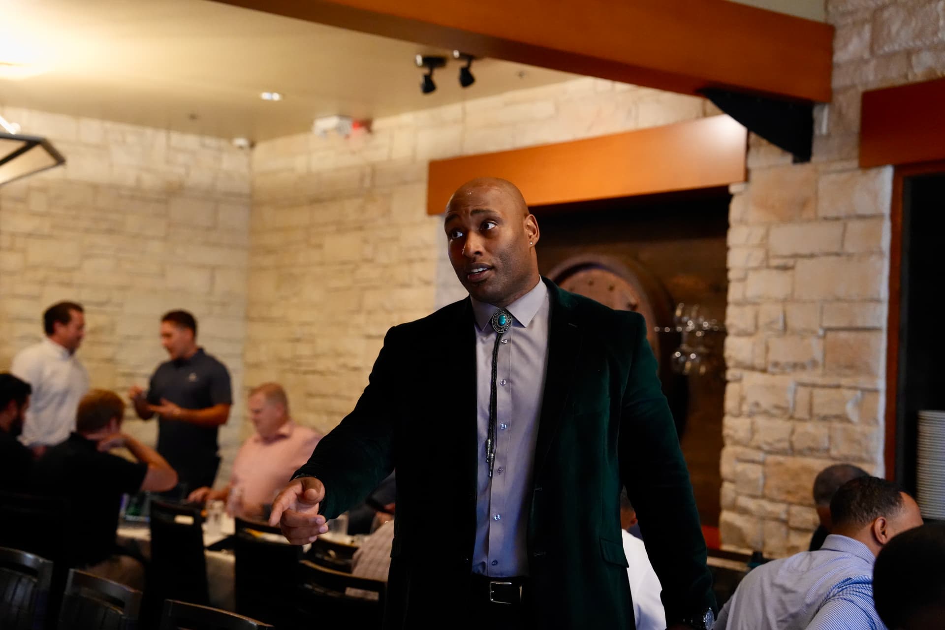 James “JB” Bryant seated with guests at a Cyber In Color dinner table