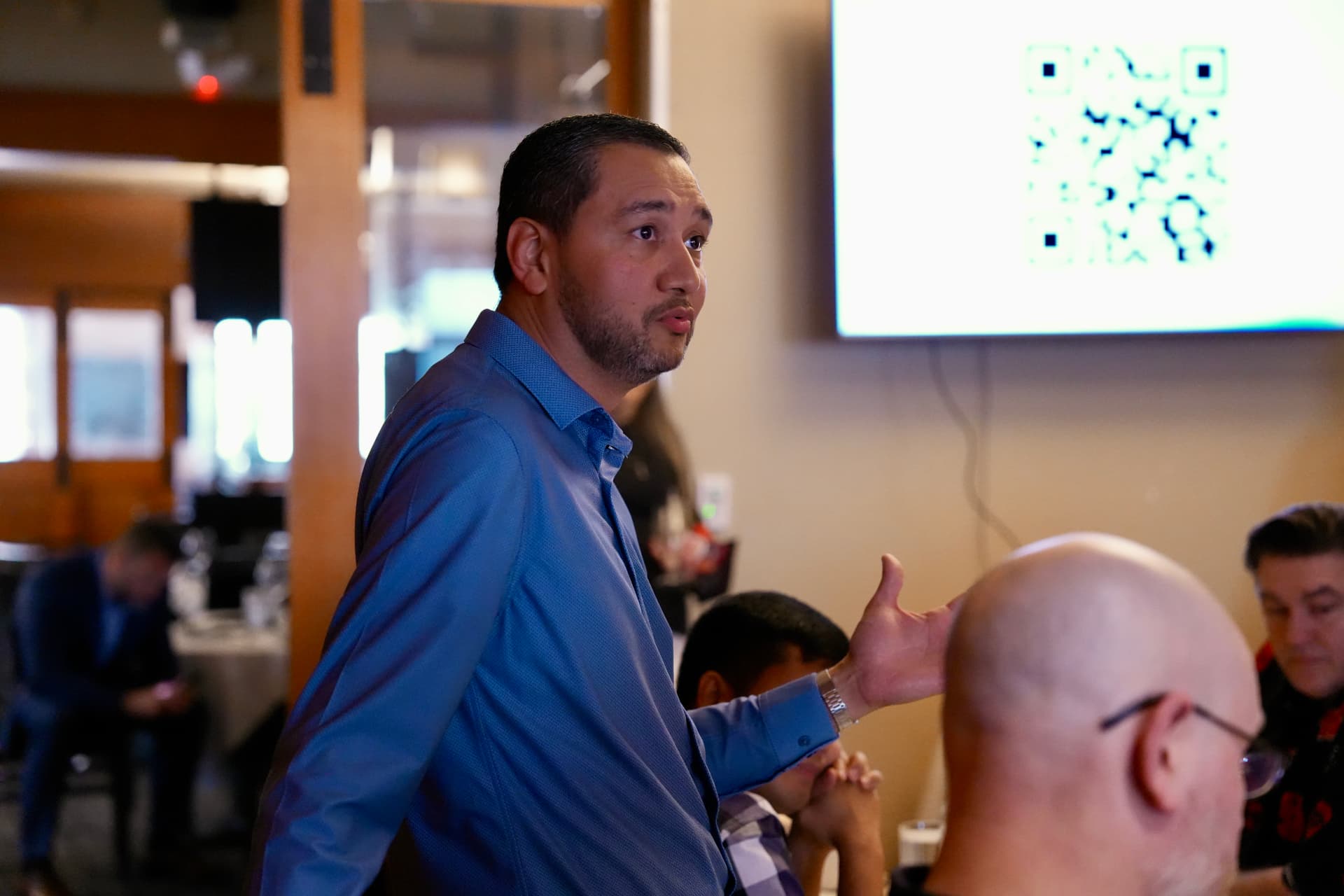 An attendee sharing his perspective during the discussion