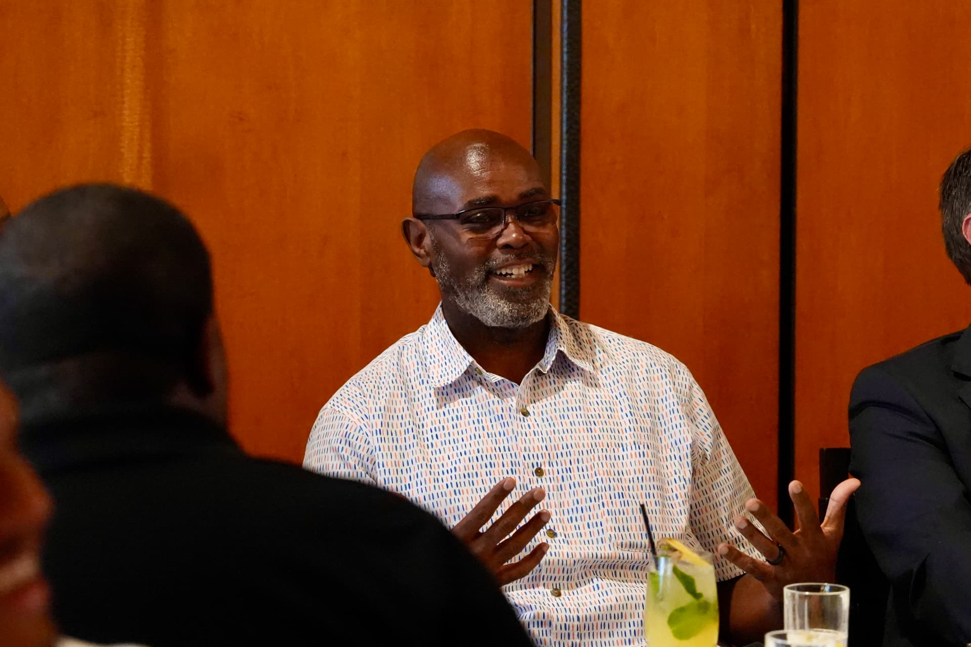 Guests laughing during the Houston roundtable conversation