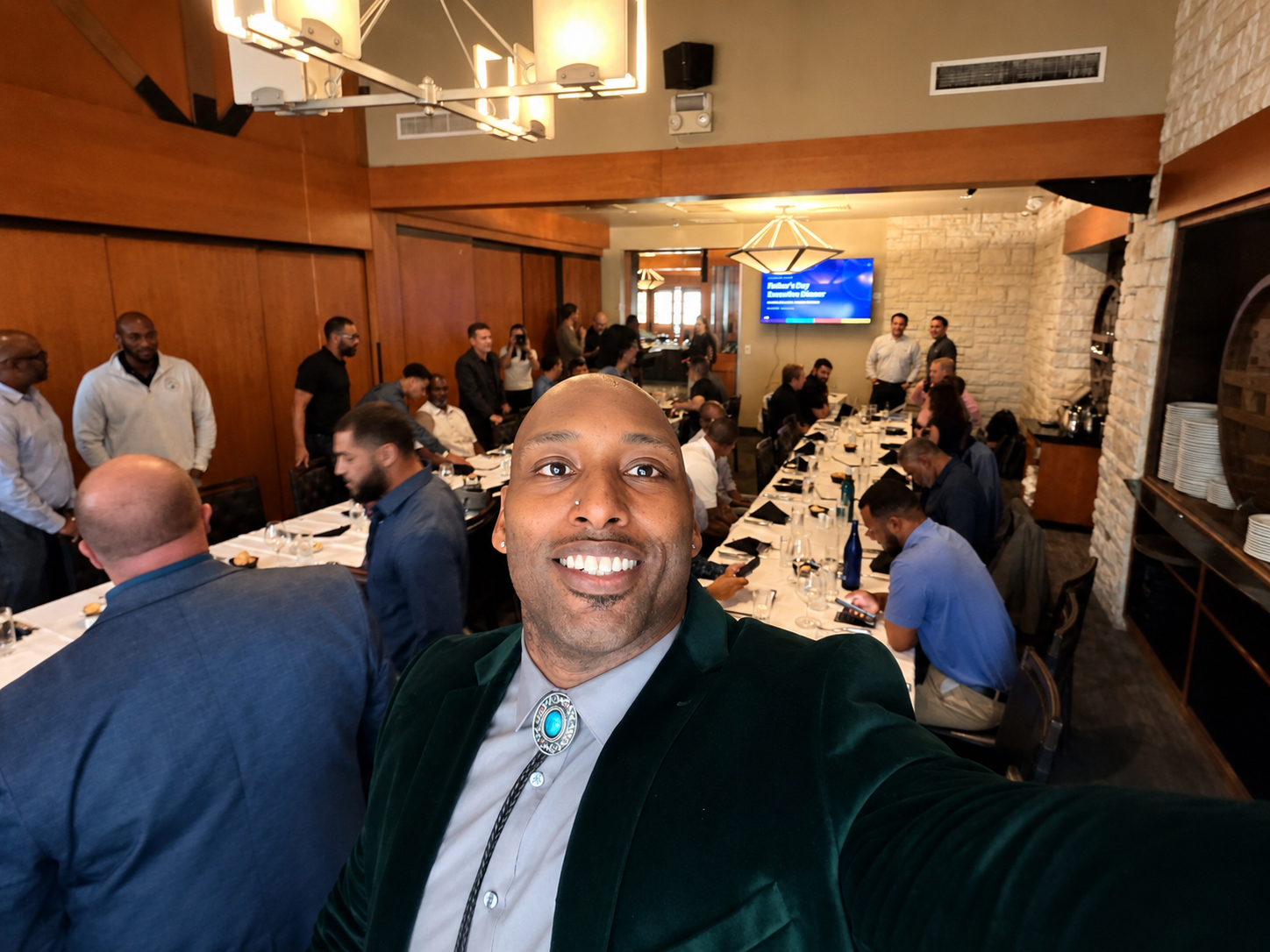 James “JB” Bryant taking a selfie with guests at a Cyber In Color dinner